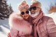 © Glittering Humanity - An older, eccentric couple embraces the winter with funky pink coats, stylish sunglasses, and furry goggle accessories, exuding confidence and joy as they pose outdoors in the snow