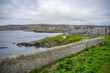 Residential Aera at Shetland Island, Scotland with view of the sea during cloudy day, wide angle shot