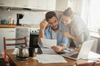 © Geber86 - Young couple doing financials in the kitchen