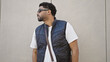 © Krakenimages.com - African american man looking to the side with serious expression wearing sunglasses over isolated white background