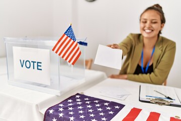 Sticker - Young beautiful hispanic woman electoral table president holding vote at electoral college