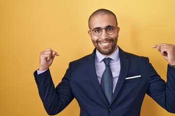 Sticker - Hispanic man with beard wearing suit and tie looking confident with smile on face, pointing oneself with fingers proud and happy.