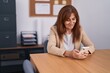 © Krakenimages.com - Middle age woman business worker using smartphone working at office
