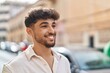 © Krakenimages.com - Young arab man smiling confident looking to the side at street