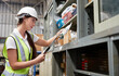 © offsuperphoto - factory worker holding a clipboard and looking at shelf in warehouse storage