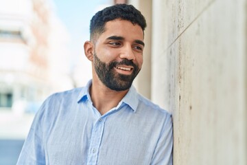 Sticker - Young arab man smiling confident looking to the side at street