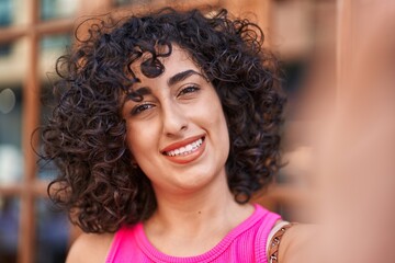 Poster - Young middle eastern woman smiling confident making selfie by camera at gaming room