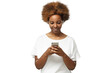 © Damir Khabirov - African american woman standing, looking at screen of phone, surfing web and smiling while browsing content