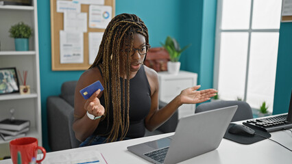 Canvas Print - African american woman business worker having video call holding credit card arguing at the office