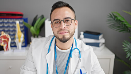 Sticker - Hispanic man doctor with serious expression at the clinic