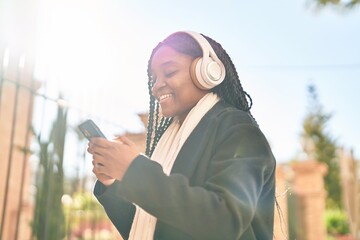 Sticker - African american woman smiling confident listening to music at street