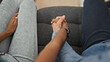 © Krakenimages.com - Beautiful couple sitting on sofa with hands together at home