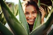 woman with aloe vera plant, natural and nutritional properties