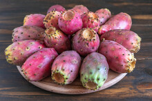 Prickly Pears On Wooden Background.