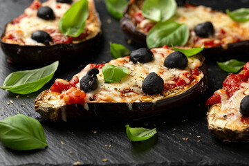 Wall Mural - Healthy Eggplant or Aubergine pizza with tomato sauce, mozzarella cheese, basil and olives