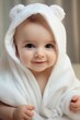 © Jorge Ferreiro - beautiful smiling baby wrapped in a towel