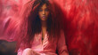 © Daniel L - Studio portrait of an African American woman with long curly hair and wearing a pink silk pajama top. Fashion and glamour. Unique hairstyle. Model with clear, natural skin.