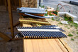 Stacks of framing nails sitting on the windowsill of a house under construction in a new residential community under construction
