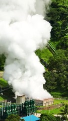 Wall Mural - Aerial view of geotermal power plant in the mountains. Geothermal station with steam and pipes. Negros, Philippines.