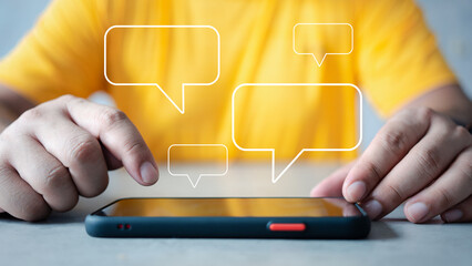 Men using smartphones to type text chat on a cell phone and chat box icons pop up. Live chat and social network concept, chatting conversation in free time at home. Social media concept.