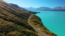 Picturesque Aerial View Of The Scenic Drive Along Turquoise Lake Pukaki With Mount Cook In The Distance, New Zealand.