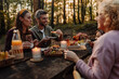 © bernardbodo - Family having lunch in the nature during picnic