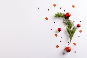 Canvas Print - Christmas stars, baubles decorations and fir tree branch with copy space on white background