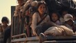 © PrismCraft - Santo Domingo Ingenio, Oaxaca/Mexico - Nov. 8, 2018: Honduran women and children fleeing poverty and gang violence in the second caravan to the U.S. sit in a dump truck taking them to their next stop.