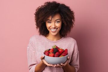 Black woman eating healthy fruit and berries