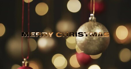 Canvas Print - Merry christmas text in gold over baubles and bokeh lights on dark background