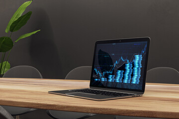 Wall Mural - Close up of laptop at workplace with growing blue coins stack hologram on concrete wall background. Saving money concept. 3D Rendering.