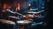A Musician Holding A Drum Stick Is Playing A Song. Music Program. Concert Stage Background.