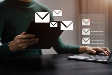 Business email marketing notification concept, Businesswoman use laptop receive message alert in the mailbox and transfer data at office.