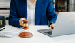 © laddawan - justice and law concept.law the desk, books, balance. Female judge in a courtroom the gavel,working with digital tablet computer