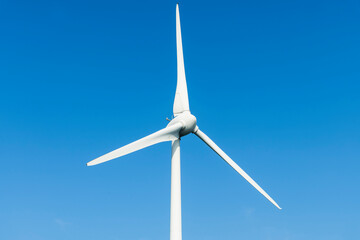 Wall Mural - Close-up of wind power systems with the blue sky background.