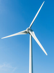 Canvas Print - Close-up of wind power systems with a blue sky background on the west coast of Taiwan.