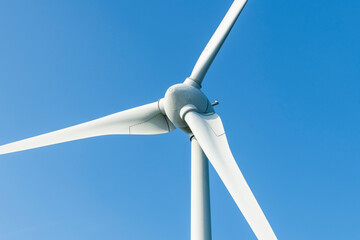 Wall Mural - Close-up of wind power systems with the blue sky background.