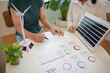 © Charlie's - Solar panels green energy Business people working in green eco friendly office business meeting creative ideas for business eco friendly professional teaching corporate people sustainable electricity
