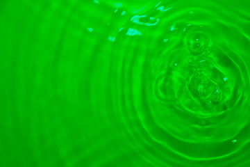 Wall Mural - the green water surface reflects light.