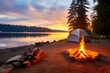 a campsite with a bonfire and tents on scenic lakeside