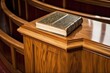 close-up of a glossy wooden pulpit with bible