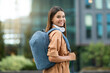 © Prostock-studio - Young woman student with backpack walking through campus