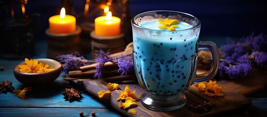 Enhance your health with a hot beverage recipe using turmeric and adaptogens featuring a blue lotus moon milk twist perfect for Halloween With copyspace for text