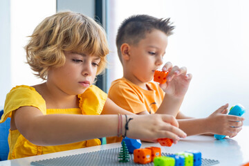 Wall Mural - robotics programming class. preschool children construct and code robot. stem education using constr