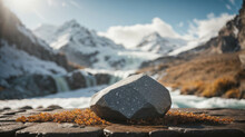 Empty Space Of Thaw Shore With Stones, Stone On Snowy Mountain Outdoor Background And Blurred Bokeh Waterfall, For Display Of Assembly Products, Space For Text