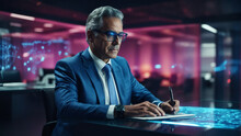 Mature Businessman With Pen Writing Some Information Over Digital Hologram Table In Futuristic Office