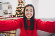 © deagreez - Photo of cute cheerful lady dressed knitted x-mas sweater tacking selfie smiling indoors house room