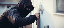 Burglary Or Thief Breaking Into A Home Opens The Lock On The Door Of A Country House, Theft Crime Criminal Case Concept, Burglar Breaking Into House