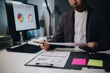 Fototapete - Businessman accountant working audit and calculating expense financial annual financial report balance sheet statement