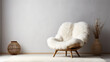 Fluffy fur sheepskin lounge chair on shaggy rug against venetian stucco wall with copy space. Minimalist home interior design of modern living room